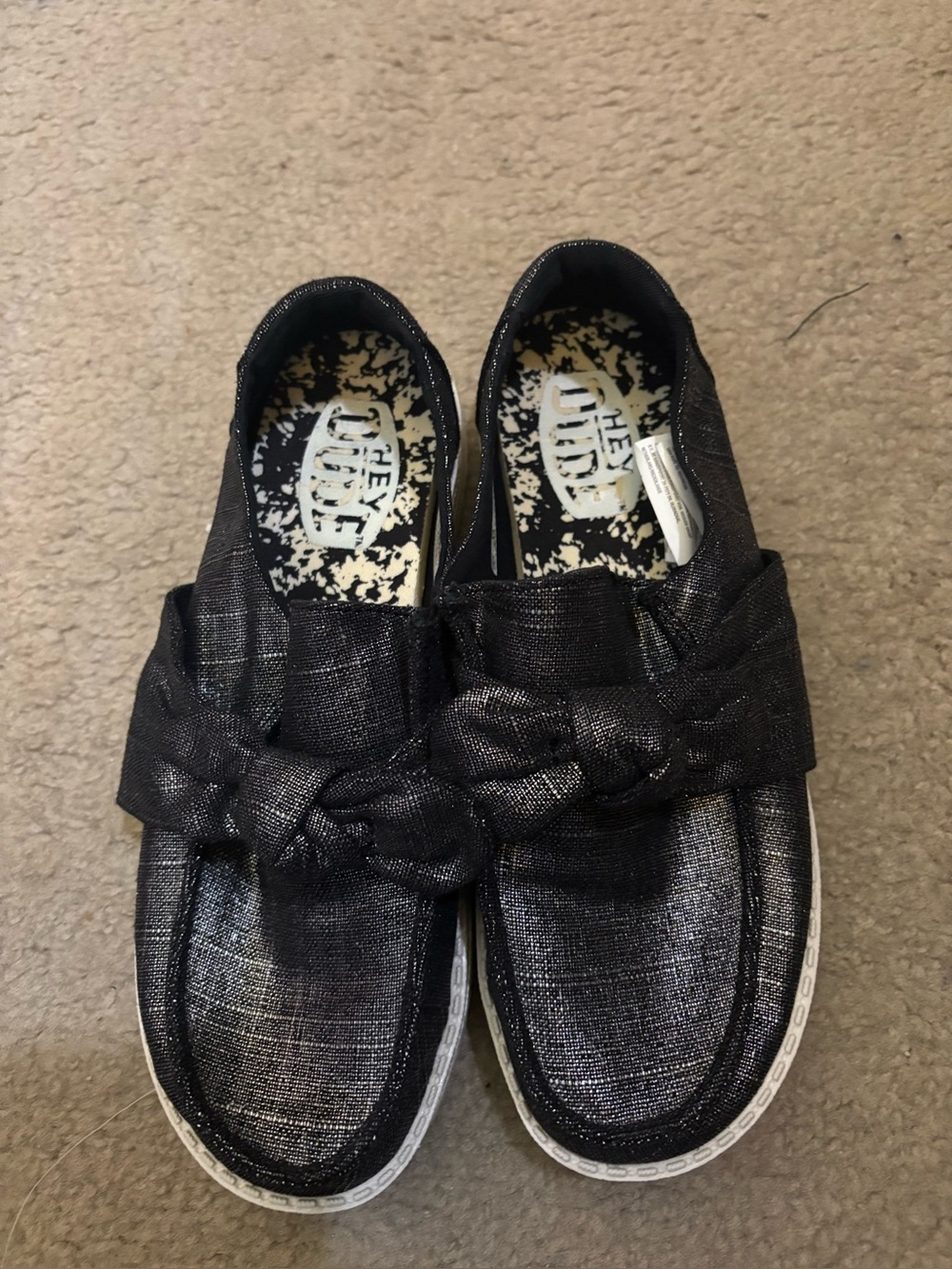 Hey Dude Wendy Black Shimmery Slip-On Shoes with Bow Detail